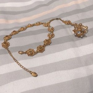 Bracelet with attached adjustable ring.